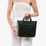 Evergreen Zipper | Model carrying crossbody tote bag with snap closure and front pocket