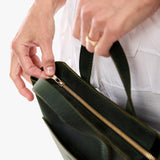 Evergreen Zipper | Model carrying crossbody tote bag with snap closure and front pocket