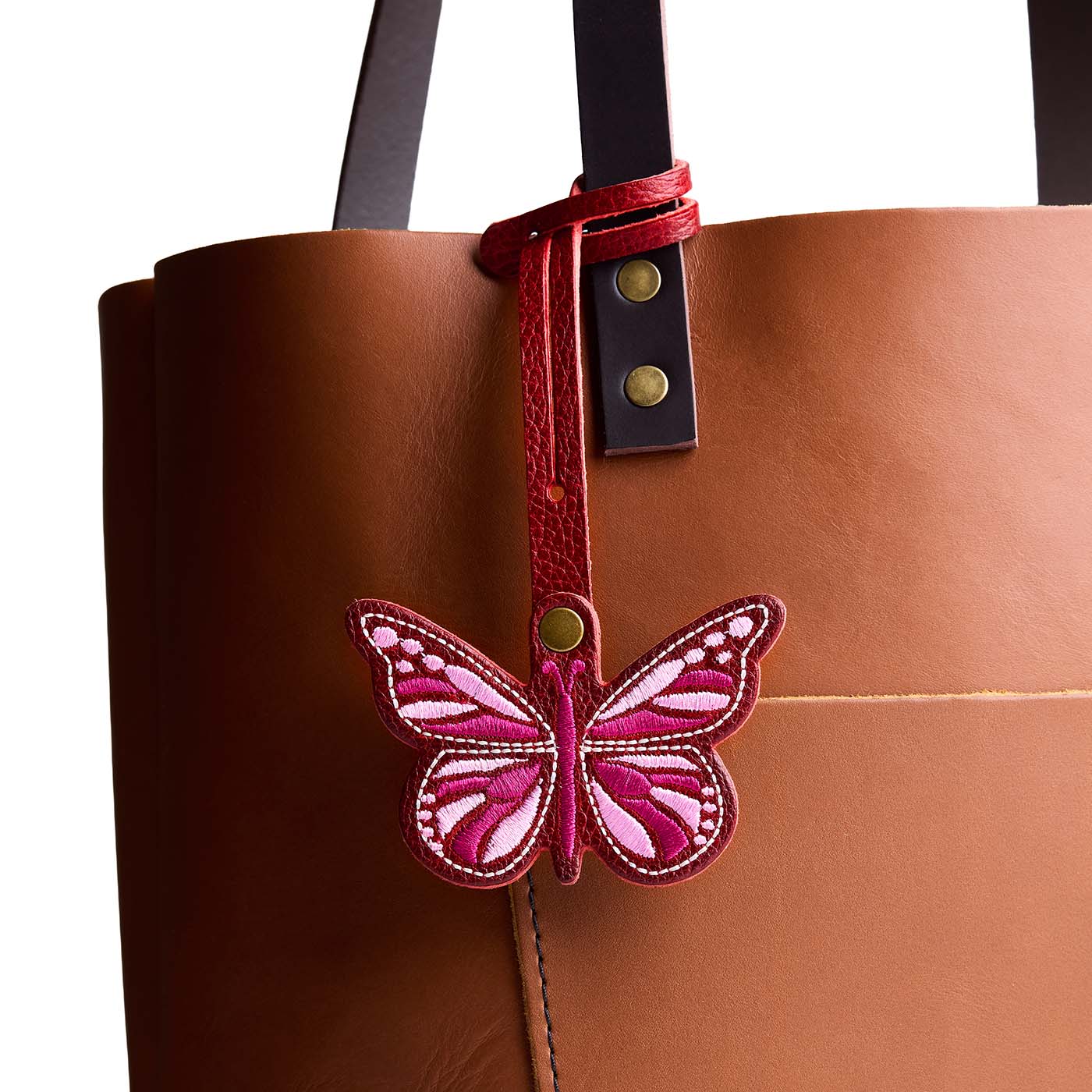Chili Red  | Embroidered butterfly tassel accessory on a bag