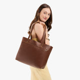 Asheville Large Classic | Model wearing leather tote bag with riveted straps and exterior key loop