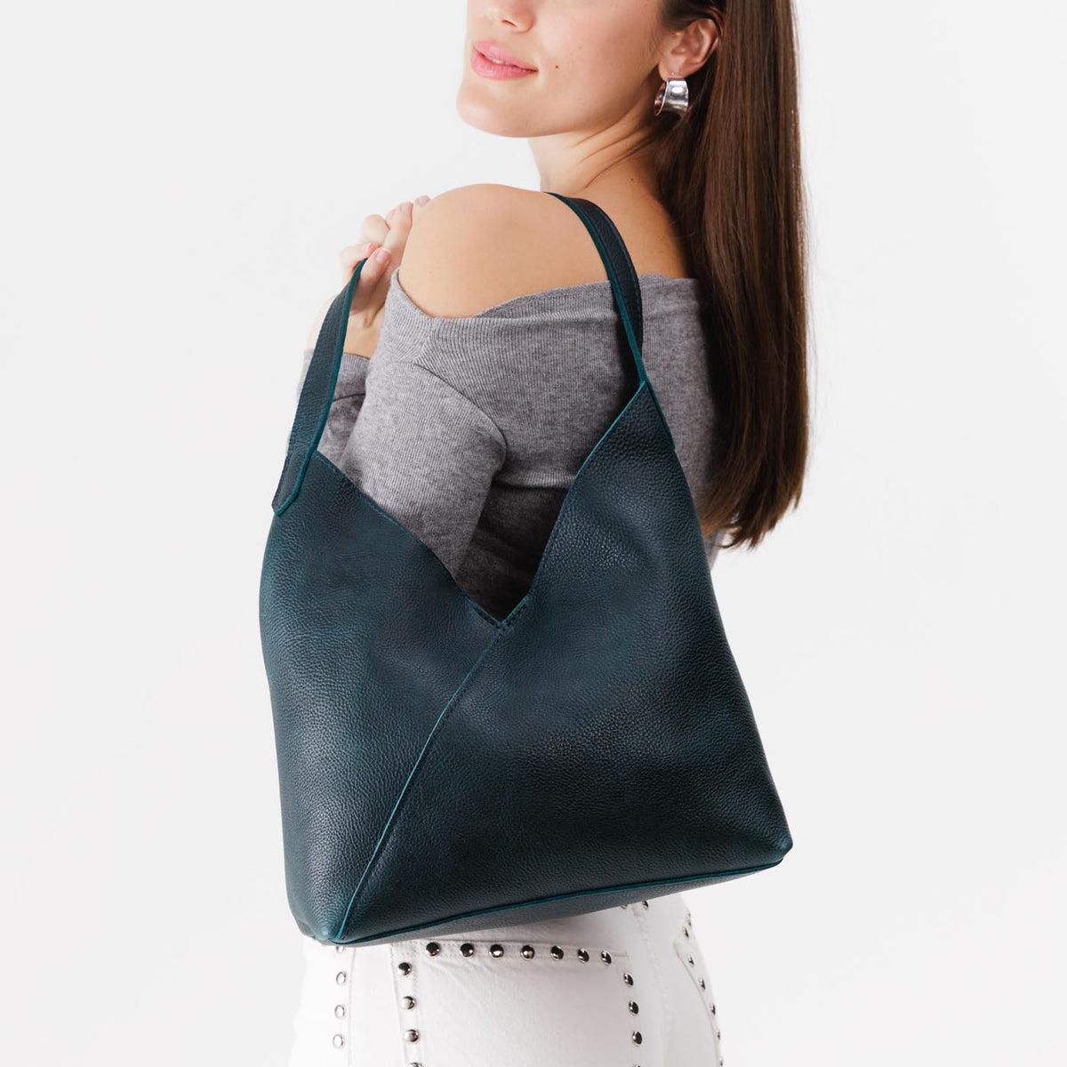 Boreal*Large | Model wearing mid-size shoulder bag with magnetic snap closure