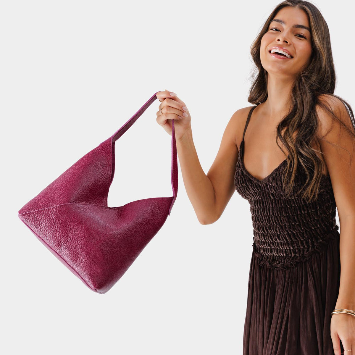 Orchid*Large | Model holding mid-size shoulder bag with magnetic snap closure