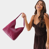 Orchid Large | Model holding mid-size shoulder bag with magnetic snap closure