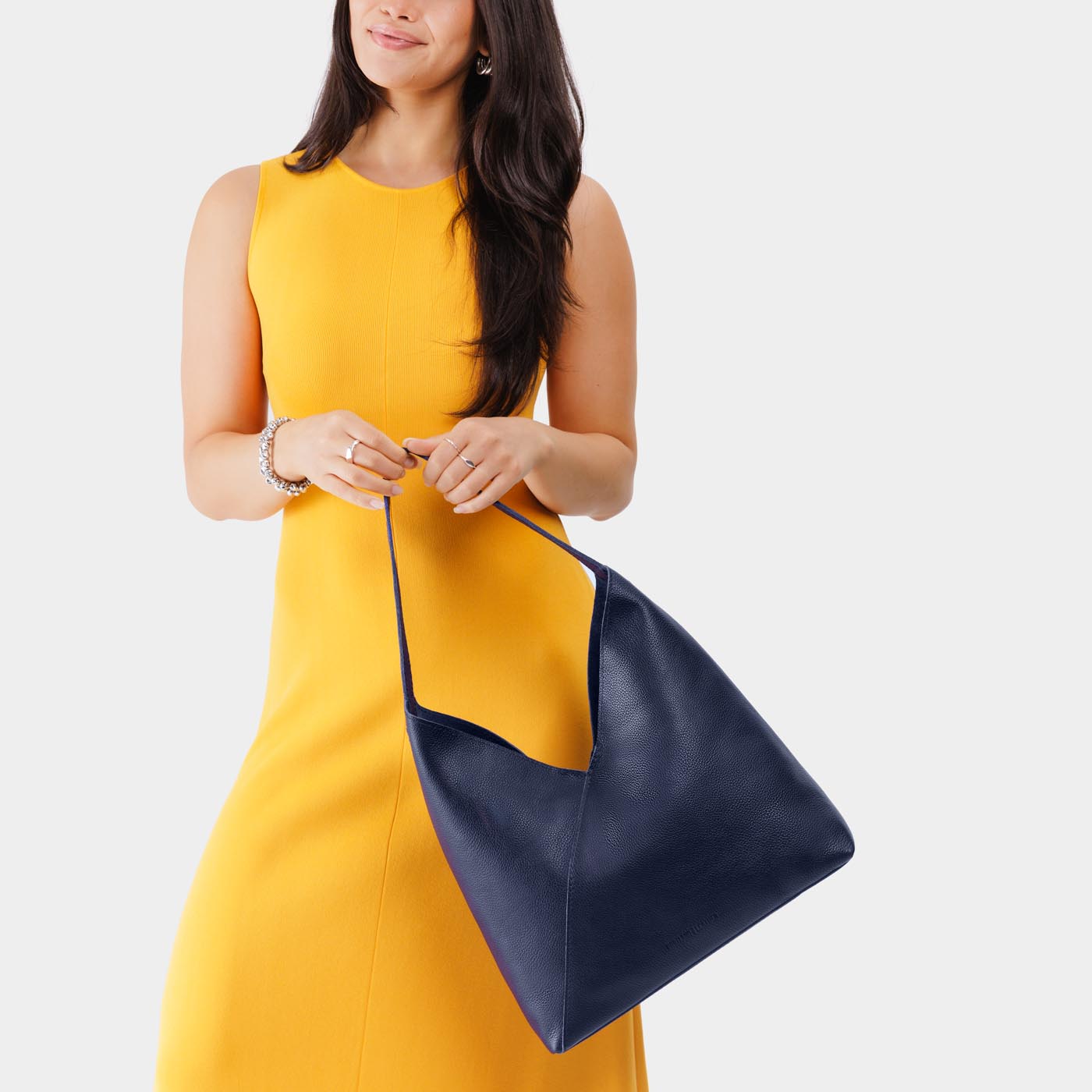 Cobalt*Oversized | Model wearing large shoulder bag with magnetic snap closure