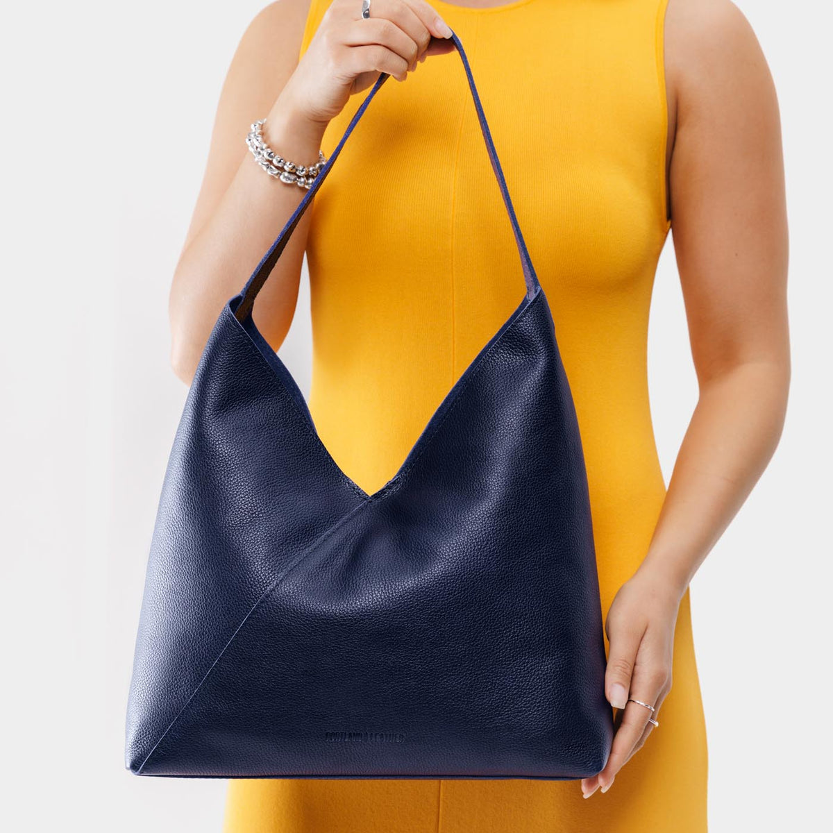 Cobalt*Oversized | Model wearing large shoulder bag with magnetic snap closure