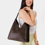 Coldbrew Oversized | Model wearing large shoulder bag with magnetic snap closure