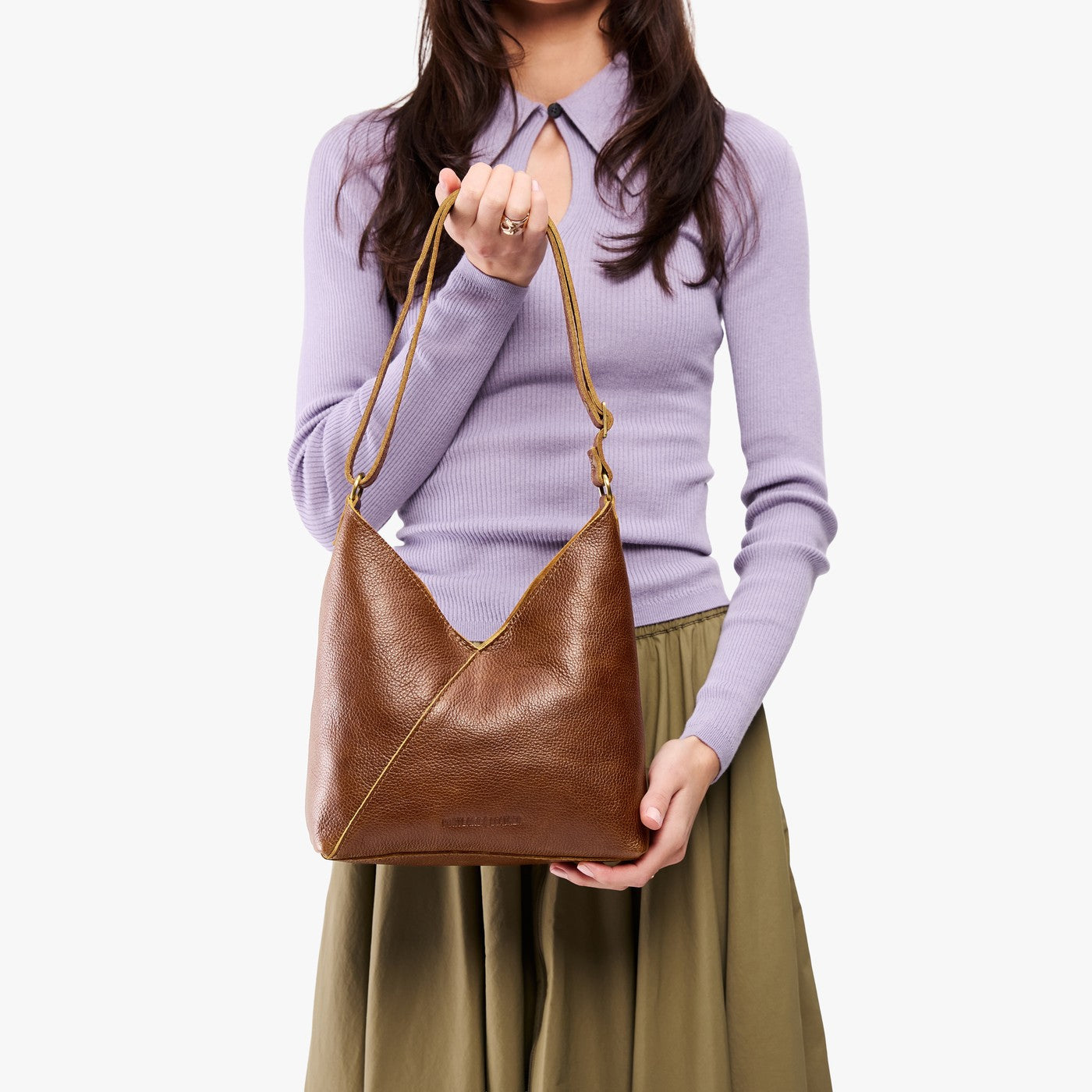 petite shoulder bag with adjustable strap and magnetic snap closure