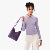 Empire Small | Model wearing petite shoulder bag with adjustable strap and magnetic snap closure