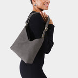 Smoke Grey Small | Model wearing petite shoulder bag with adjustable strap and magnetic snap closure