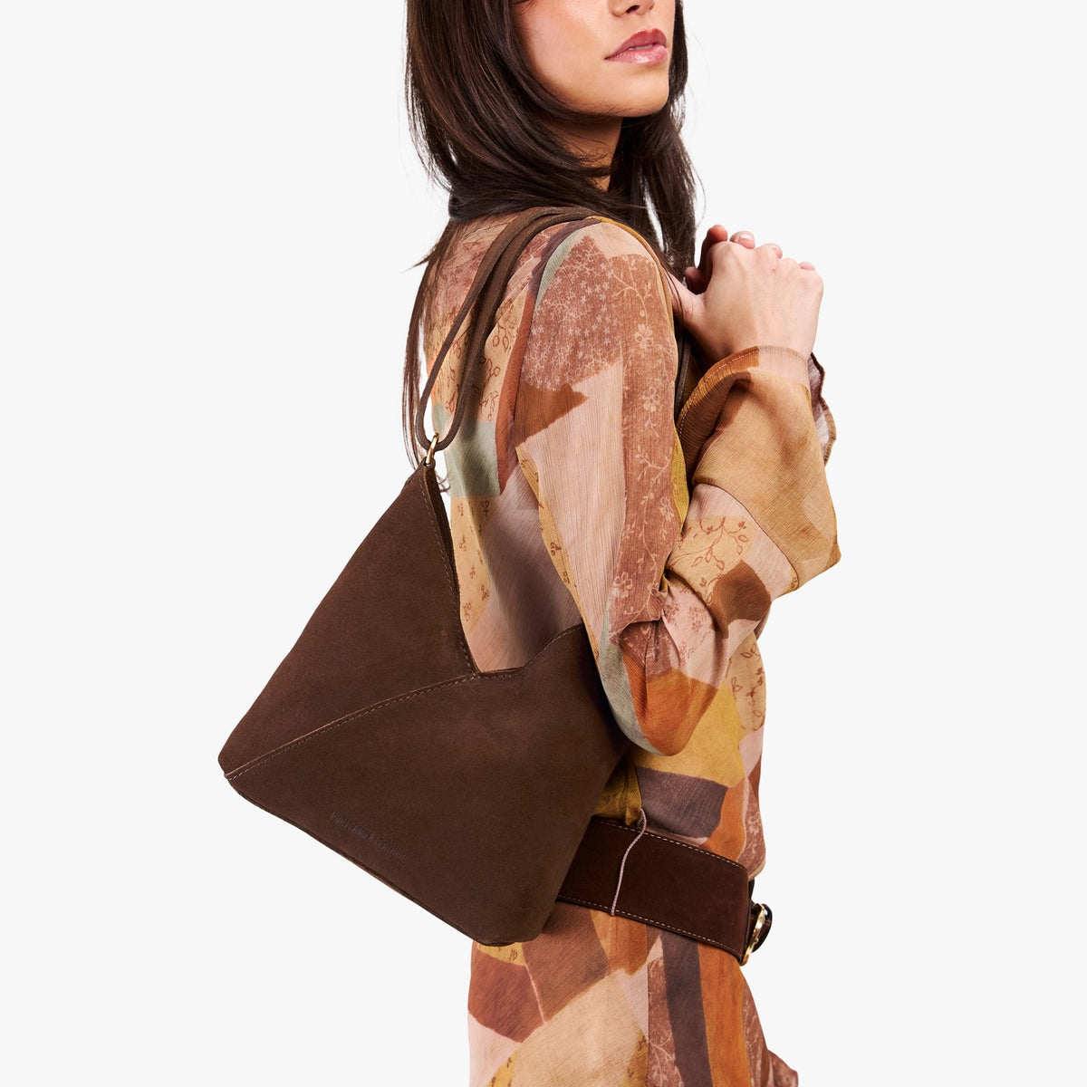 Stagecoach*Small | Model wearing petite shoulder bag with adjustable strap and magnetic snap closure