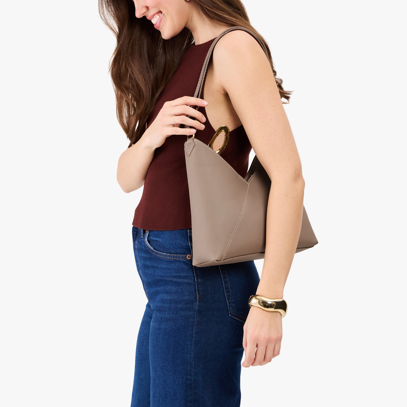Stone*Small | Model wearing petite shoulder bag with adjustable strap and magnetic snap closure