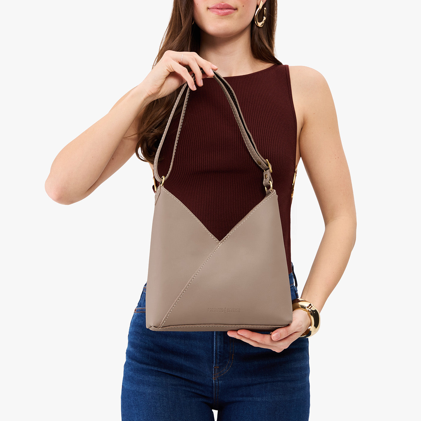 Stone*Small | Model wearing petite shoulder bag with adjustable strap and magnetic snap closure
