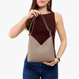 Stone Small | Model wearing petite shoulder bag with adjustable strap and magnetic snap closure