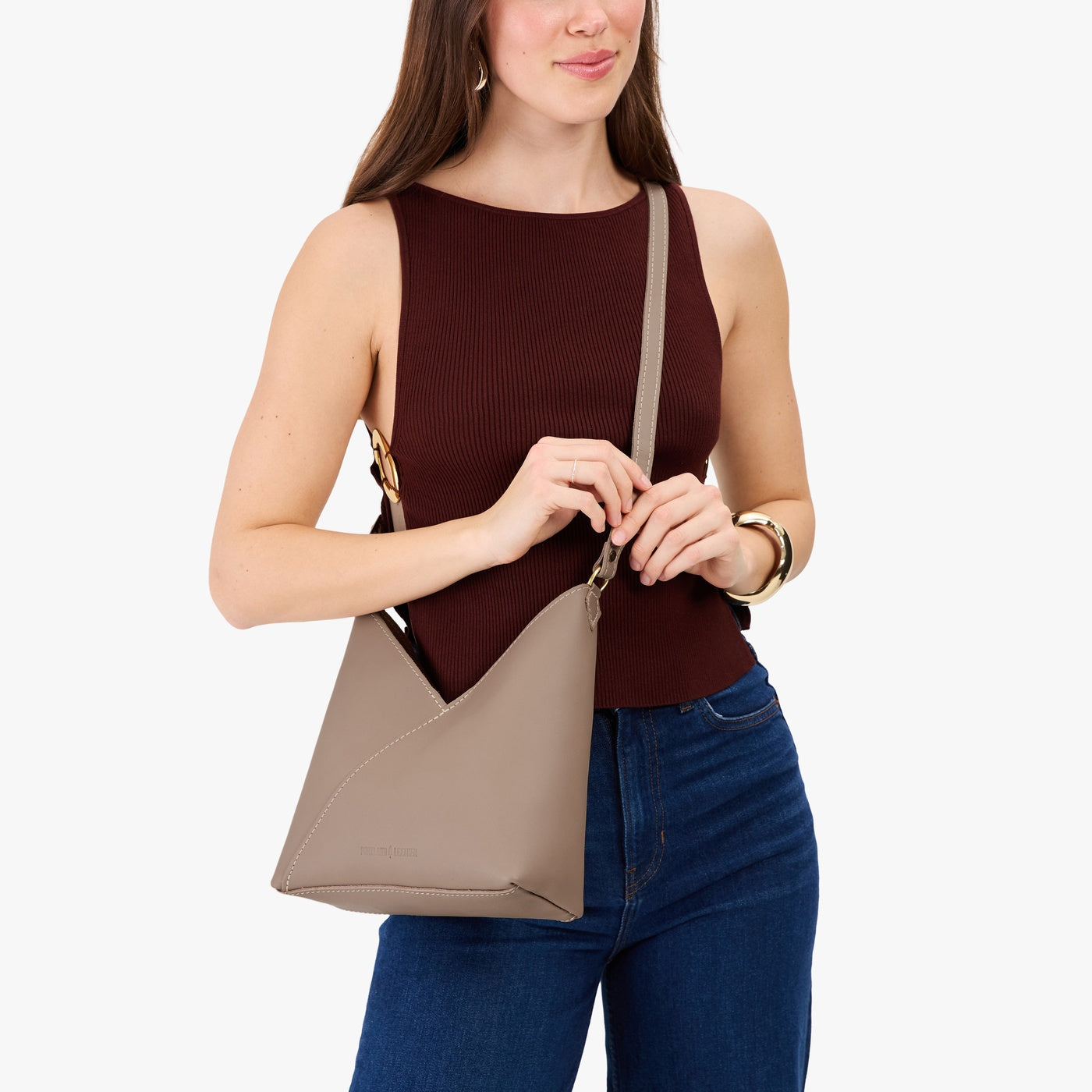 Stone*Small | Model wearing petite shoulder bag with adjustable strap and magnetic snap closure