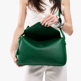 Bacalar Medium | Model wearing a leather Crossbody with a flap and magnetic closure