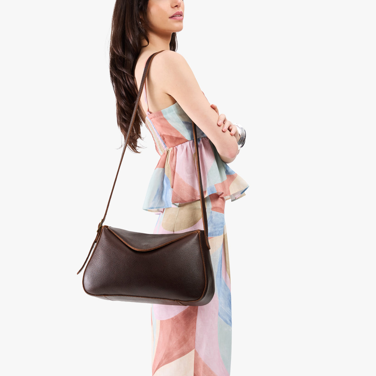 Coldbrew*Medium | Model wearing a leather Crossbody with a flap and magnetic closure