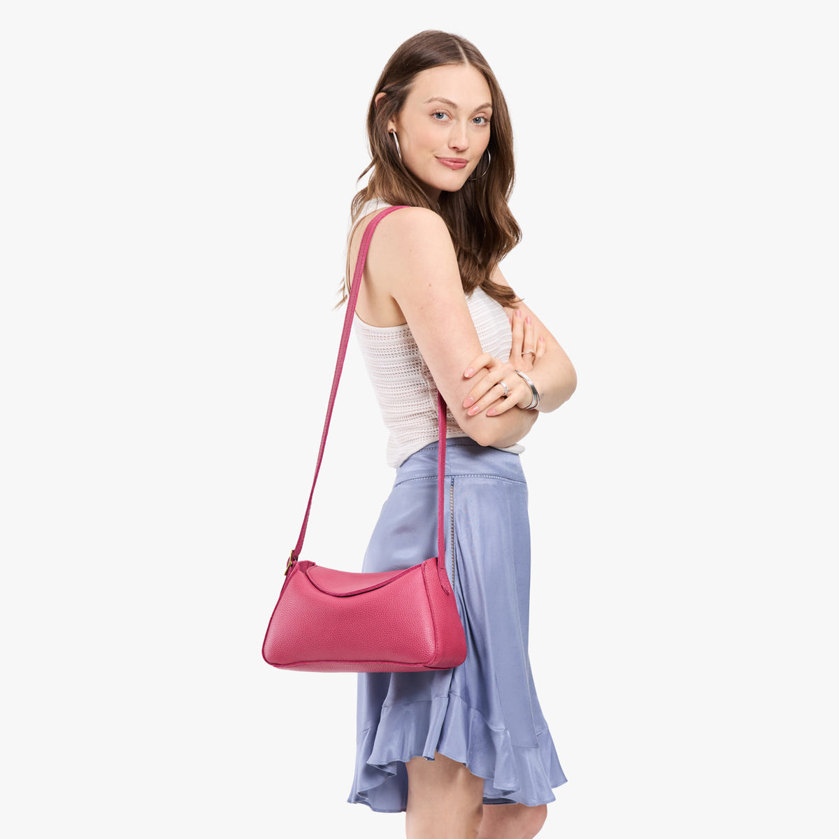 Wild Rose*Small | Model wearing a leather Crossbody with a flap and magnetic closure