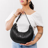 Pebbled--black Small | Crescent shaped shoulder bag with zipper closure and adjustable strap