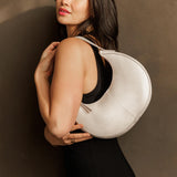 Bone Small | Crescent shaped shoulder bag with zipper closure and adjustable strap