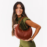 Chestnut Small | Crescent shaped shoulder bag with zipper closure and adjustable strap