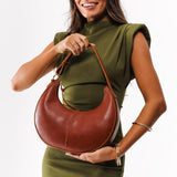 Chestnut Small | Crescent shaped shoulder bag with zipper closure and adjustable strap