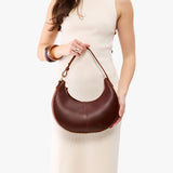 Cognac Small | Crescent shaped shoulder bag with zipper closure and adjustable strap