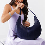 Cobalt Large | Crescent shaped shoulder bag with zipper closure and adjustable strap
