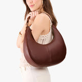 Cognac Large | Crescent shaped shoulder bag with zipper closure and adjustable strap