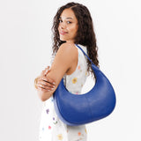 Molino Blue Large | Crescent shaped shoulder bag with zipper closure and adjustable strap