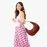 Nutmeg Large | Crescent shaped shoulder bag with zipper closure and adjustable strap
