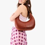 Nutmeg Large | Crescent shaped shoulder bag with zipper closure and adjustable strap