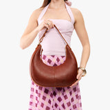 Nutmeg Large | Crescent shaped shoulder bag with zipper closure and adjustable strap