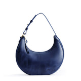 Cowboy Blue Small | Crescent shaped shoulder bag with zipper closure and adjustable strap
