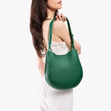 Bacalar Medium | Model holding round leather purse with adjustable shoulder strap
