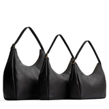 Pebbled--black | Size comparison image of oversized, large, and medium u-shaped, flat-bottomed leather shoulder bags with adjustable strap