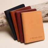 Naturale | Group of wallets staged on a piece of drift wood