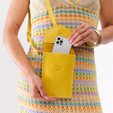 All Variants | Model pulling a smartphone out of a Parker Phone Bag in Naples