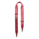 Firepop | Leather and webbing strap with repeating PLG lettering on a white background