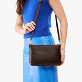 Woman holding a Classic Coldbrew Poppy Purse