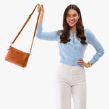 Sienna Small | Model wearing a zip top crossbody bag with detachable strap