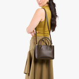 Grizzly Small | Model wearing petite tote purse with structured leather handles and crossbody strap