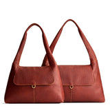 Nutmeg | Comparison image of a slouchy triangle shaped shoulder bag with a flap