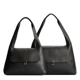 Pebbled--black | Comparison image of a slouchy triangle shaped shoulder bag with a flap
