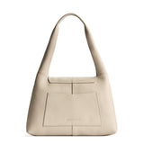 Pebbled Bone Medium | Slouchy triangle shaped shoulder bag with a flap