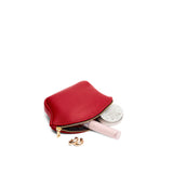 Cherry Small | Seashell shaped leather makeup bag with curved top zipper and flat bottom