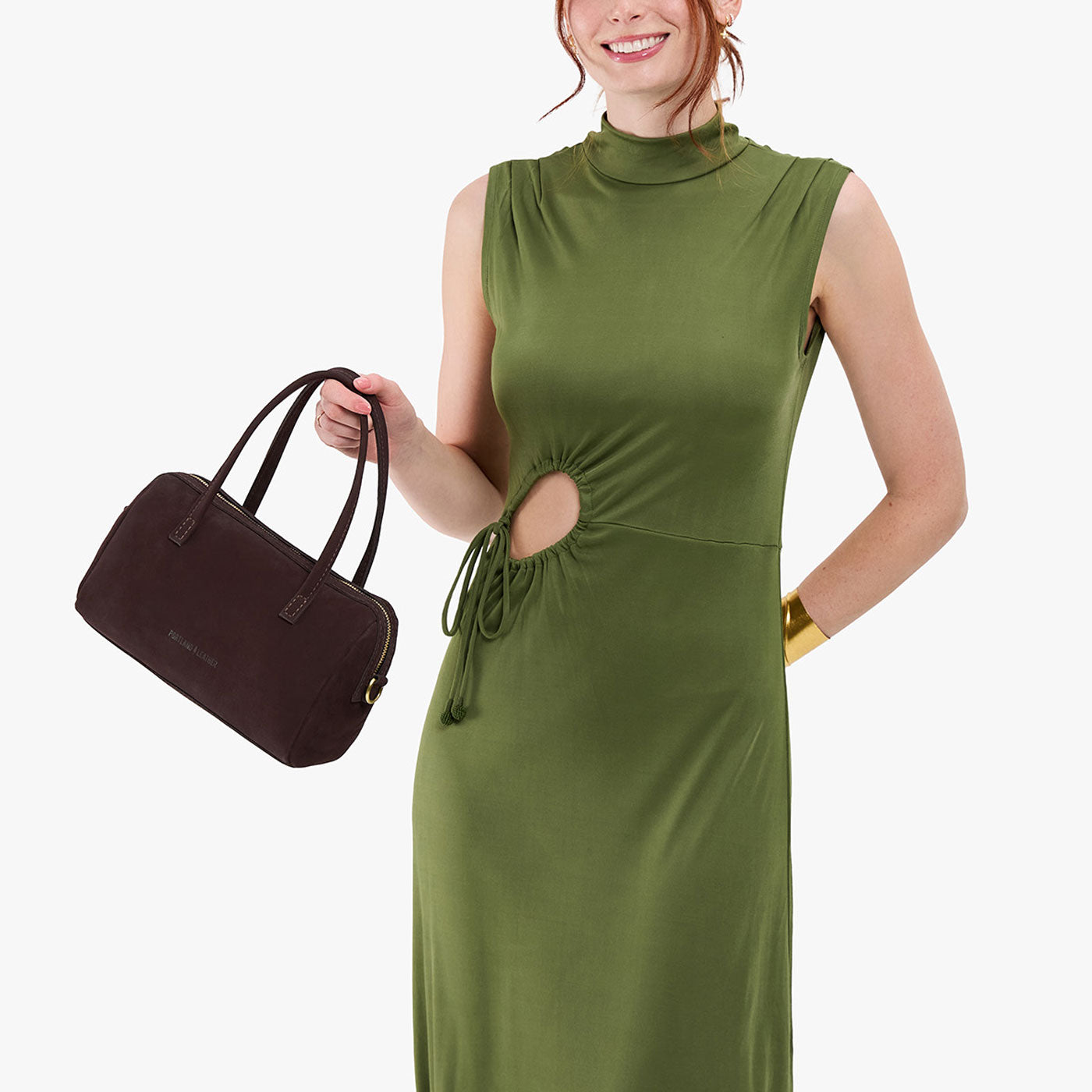Velvet Brown*Large | Model holding mini duffle shaped handbag with crossbody strap