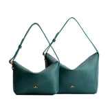 Sea Glass | Size comparison shot of small and large slouchy leather shoulder bags with zipper opening and three metal tree emblems