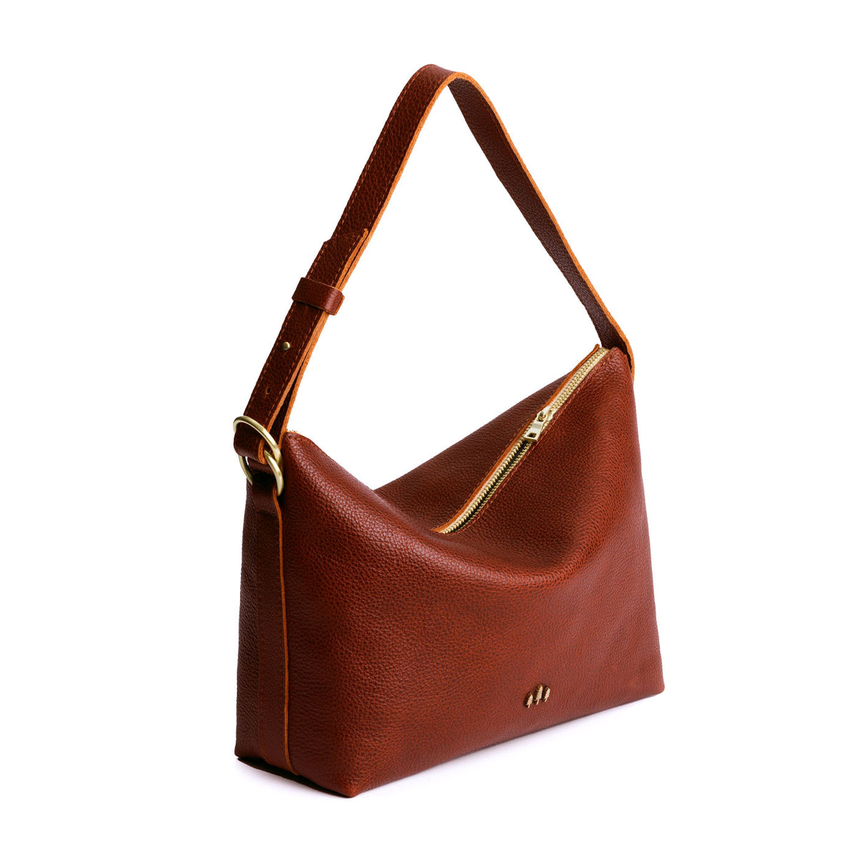 Nutmeg*Large | Medium sized slouchy leather shoulder bag with zipper opening and three metal tree emblems
