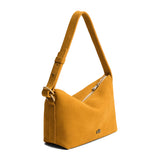 Dijon Small | Slouchy Shoulder Bag that has a zipper opening and three metal tree emblems on a white background