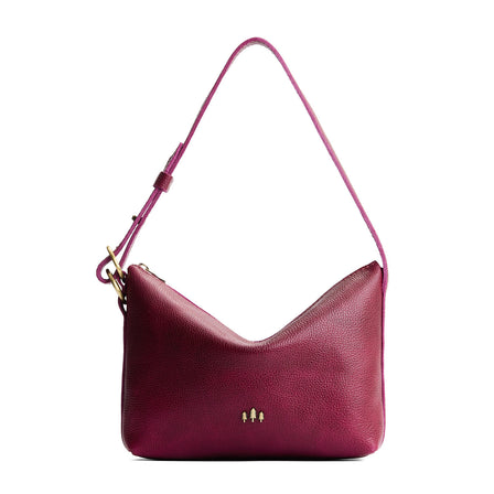 Orchid*Large | Model Wearing medium sized slouchy leather shoulder bag with zipper opening and three metal tree emblems